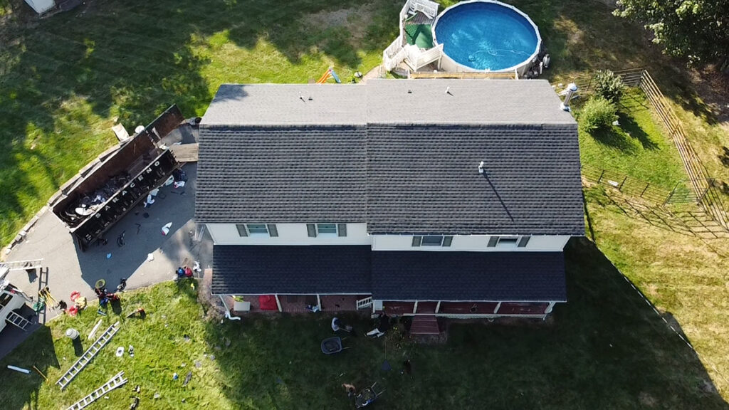 Aerial photo of a reshingled roof on a two-storey home completed by Everest