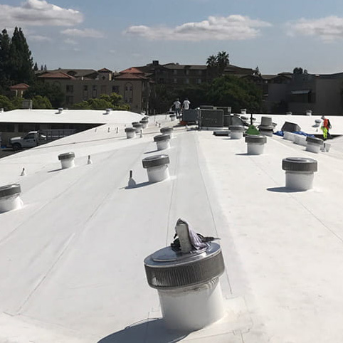 Photo of a TPO roof on a commercial building in New Jersey in the process of being installed by Everest Construction Group.