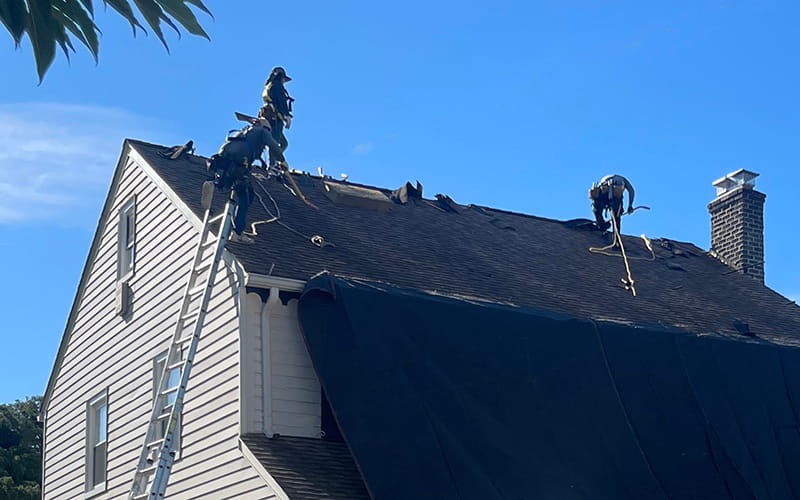 Photo of Everest Construction Group workers replacing a roof on a New Jersey home